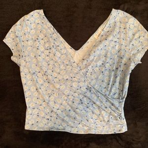 Cropped wrap-style top. Pale blue w/ flowers.